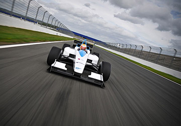 A Formula E car driving on a racing track